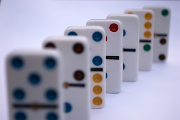 Image showing Arrangement of colored dominoes in a line 