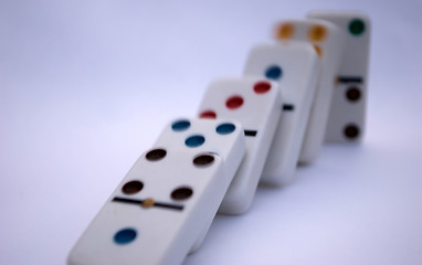 Image showing Arrangement of falling colored dominoes in a line 