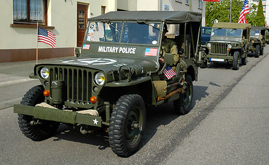 Image showing three old MP Jeep