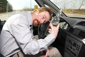 Image showing Drunk man sitting in drivers