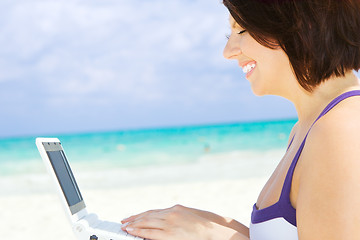 Image showing woman with laptop computer on the beach