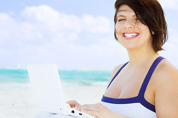 Image showing woman with laptop computer on the beach