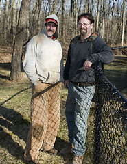 Image showing two workmen repairing chain link fence