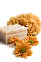 Image showing natural sponge, soap and flowers