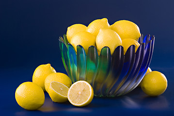 Image showing lemons in blue green bowl on blue background