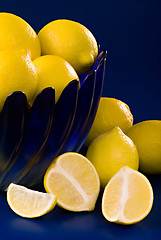 Image showing lemons in blue bowl on blue background