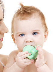 Image showing baby boy with green plastic toy