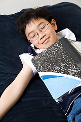 Image showing Sleeping young student