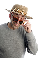 Image showing aging artist thinking  suglasses adventure hat