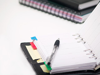 Image showing Office stationary - Pen and diary on white