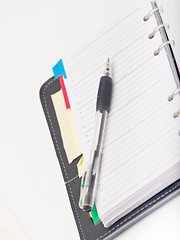 Image showing Office stationary - Pen and diary on white