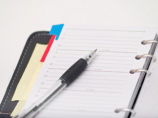 Image showing Office stationary - Pen and diary on white