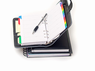 Image showing Office stationary - Pen and diary on white