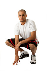 Image showing Crouching Sporty guy