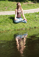 Image showing young woman is meditating