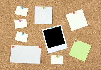 Image showing Post-it notes, papers and photo on a corkboard