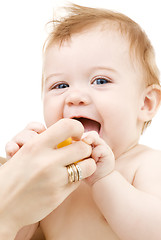 Image showing baby boy with yellow plastic toy