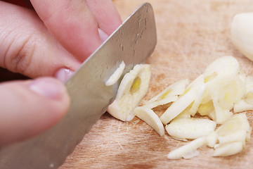 Image showing Chopping the Garlic