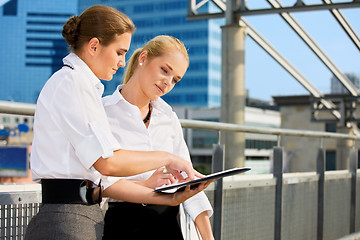 Image showing two businesswomen with paper chart