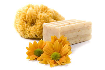 Image showing natural sponge, soap and flowers