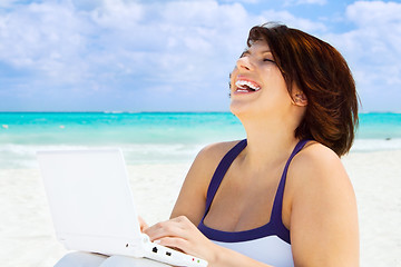 Image showing woman with laptop computer on the beach