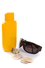 Image showing sunglasses and lotion