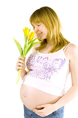Image showing pregnant woman with yellow tulips
