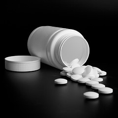 Image showing bottle with white pills