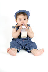 Image showing Baby with a milk bottle