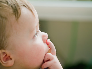 Image showing Thoughtful baby boy thinking about copyspace