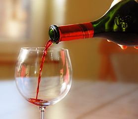 Image showing Pouring red wine