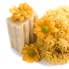 Image showing natural sponge, soap and flowers