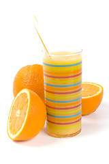 Image showing glass of juice and oranges