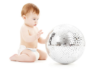 Image showing adorable baby boy with big disco ball