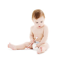 Image showing baby boy in diaper with toothbrush