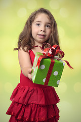 Image showing Pretty girl giving present