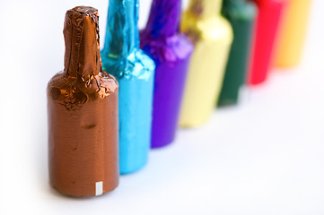 Image showing Colorful chocolate bottles