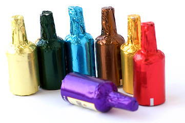 Image showing Colorful chocolate bottles