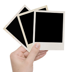 Image showing three photo frames in a hand