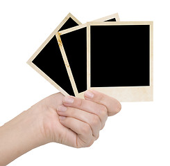 Image showing three photo frames in a hand