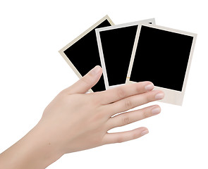 Image showing three photo frames in a hand