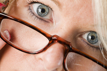 Image showing pretty attractive blond woman close up reading glasses