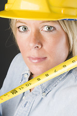 Image showing pretty blond female construction worker hard hat helmet