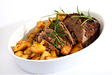 Image showing Lamb joint and roast potatoes