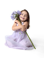 Image showing Beautiful smiling girl with pretty flower