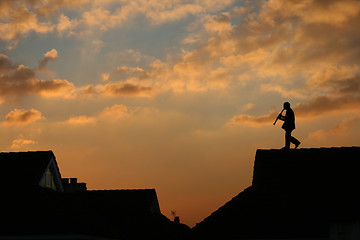 Image showing Musician on the roof