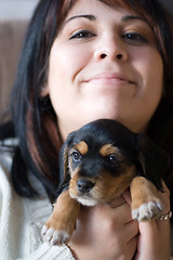 Image showing Woman Holding a Puppy