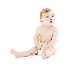 Image showing baby boy in diaper with toothbrush