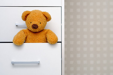 Image showing Teddy bear in dresser