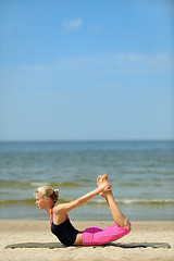 Image showing Beautiful female workout on the beach